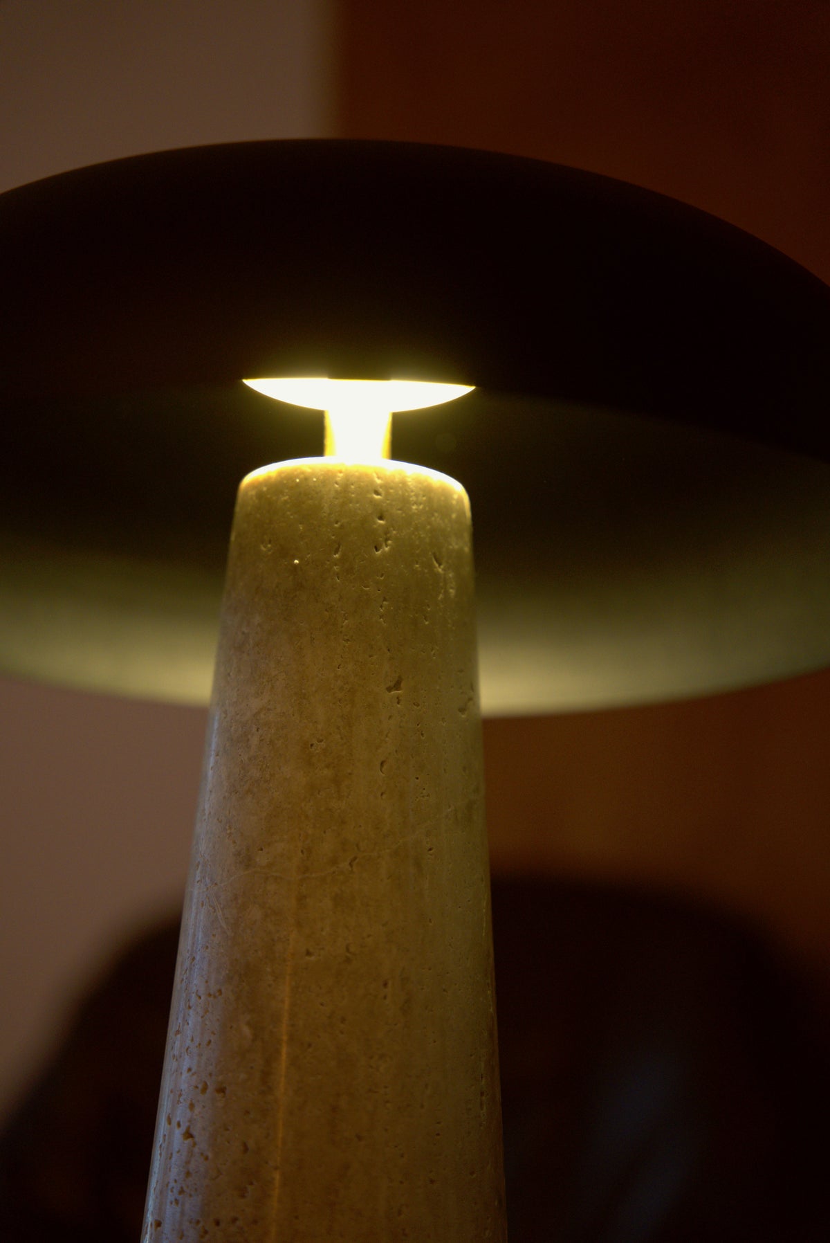 Under the Corvus dome, the emitter glowing above the travertine cone.
